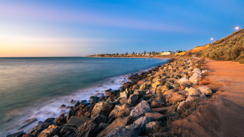 Christies Beach coastline with Witton Bluff trail at dusk while viewed towards the Esplanade - Australian Stock Image
