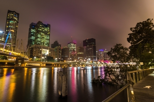 City buildings overlooking the Brisbane River at night - Australian Stock Image