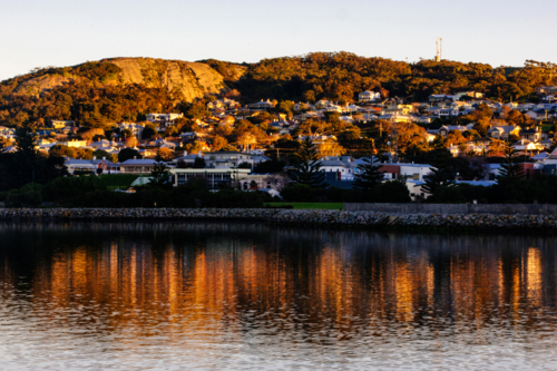 City of Albany reflects into the Princess Harbour in morning light - Australian Stock Image