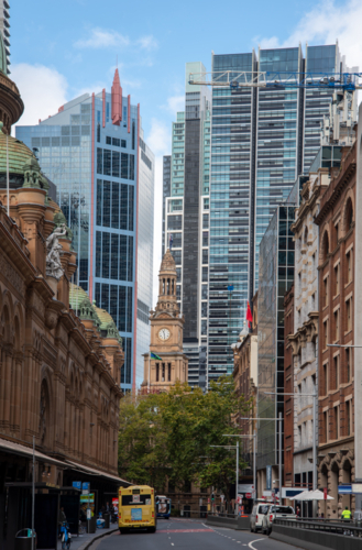 Clarence Street in Sydney with Town Hall clock tower and glass buildings behind - Australian Stock Image
