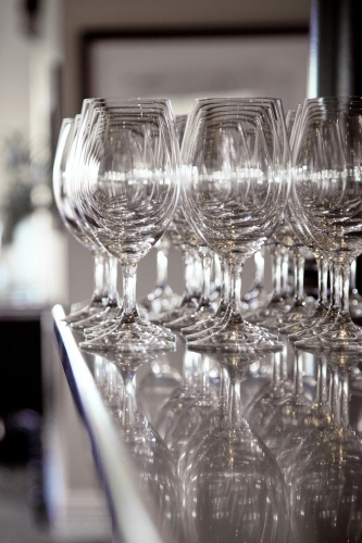 Clean wine glasses on a bar