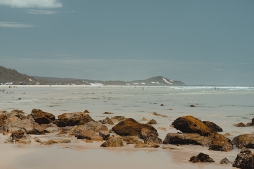 Clear ocean water and sand dunes at the beach near Mulgumpin Camping Area, North Point - Australian Stock Image