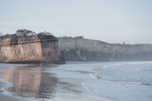 Cliffs on the edge of the ocean on overcast day - Australian Stock Image