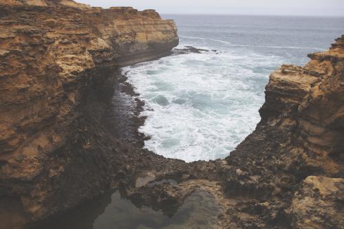 Cliffs surrounding a bay - Australian Stock Image