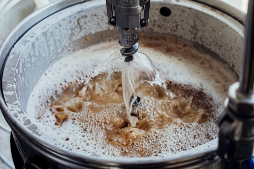 Close-up of a beer mashing procedure. - Australian Stock Image
