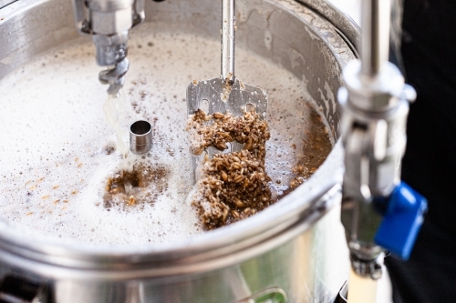 Close-up of a beer mashing procedure. - Australian Stock Image