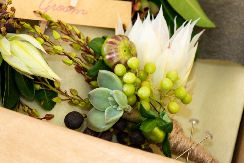 Close up of a groom's buttonhole or boutonniere ready to be packaged - Australian Stock Image