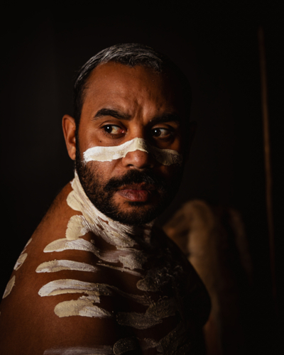 Close-up of aboriginal man with white body paint - Australian Stock Image