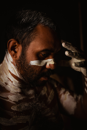 Close-up of aboriginal man with white body paint - Australian Stock Image