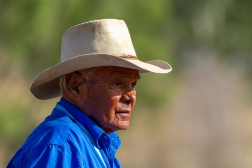 Close-up of an aboriginal stockman with Akubra hat. - Australian Stock Image
