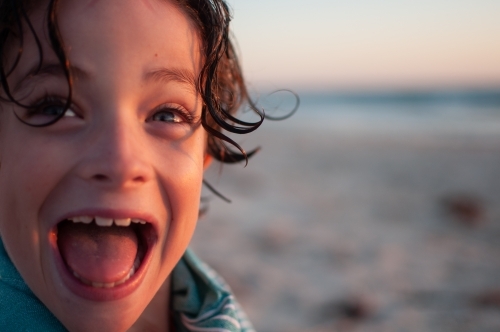 Close up of child's face at beach