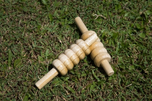 Close up of cricket bails lying on grass