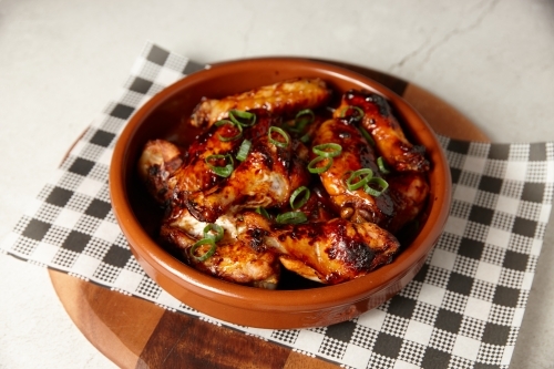 Close up of crispy chicken wings - Australian Stock Image
