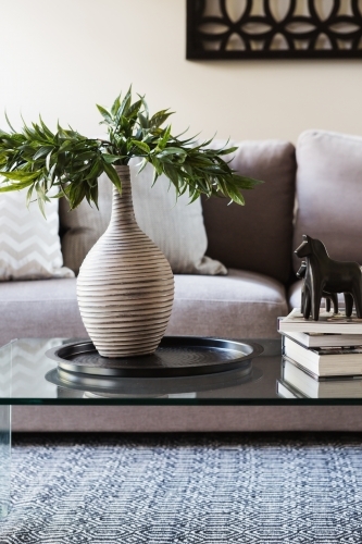 Close up of decor items on a living room coffee table - Australian Stock Image