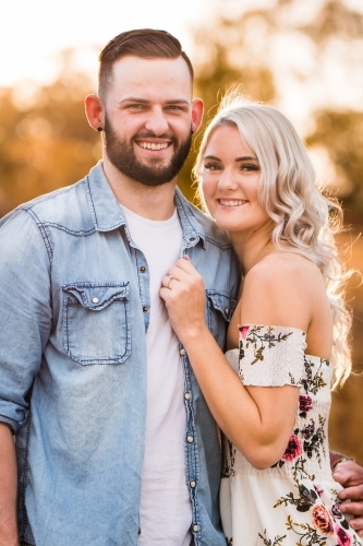 Close up of engaged couple standing together smiling - Australian Stock Image