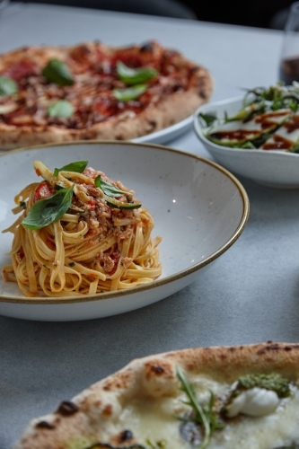 Close up of fresh pasta dish on table - Australian Stock Image