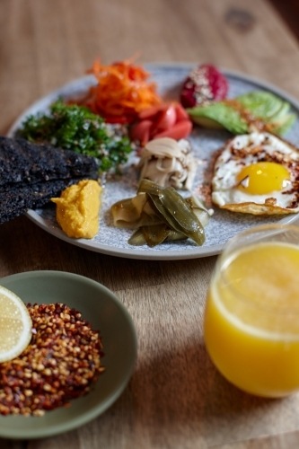 Close-up of healthy vegetarian meal on wooden table - Australian Stock Image