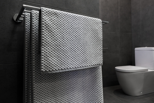 Close up of luxury bathroom towels in a monochrome ensuite