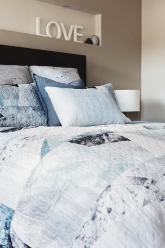Close up of luxury bed linen in a master bedroom - Australian Stock Image