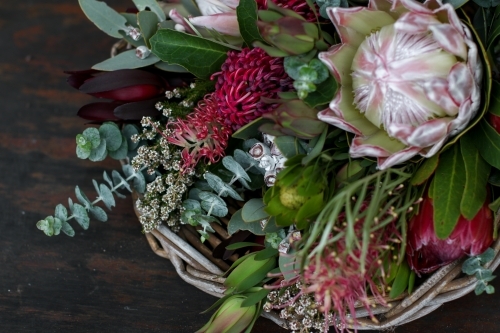 Close up of native floral arrangement in a wicker basket - Australian Stock Image