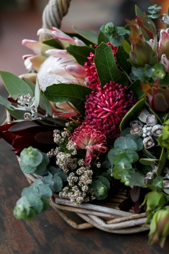 Close up of native floral arrangement in a wicker basket - Australian Stock Image