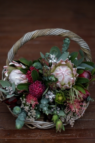 Close up of native floral arrangement in a wicker basket - Australian Stock Image