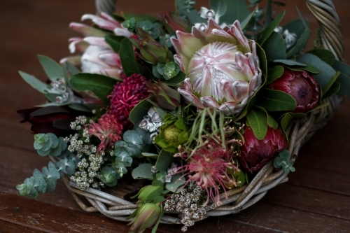Close up of native floral arrangement in a wicker basket