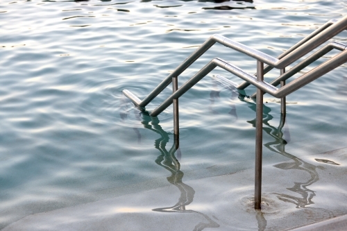 Close-up of sea pool and railings on dusk - Australian Stock Image