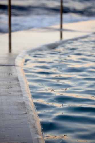 Close-up of sea pool and railings on dusk - Australian Stock Image