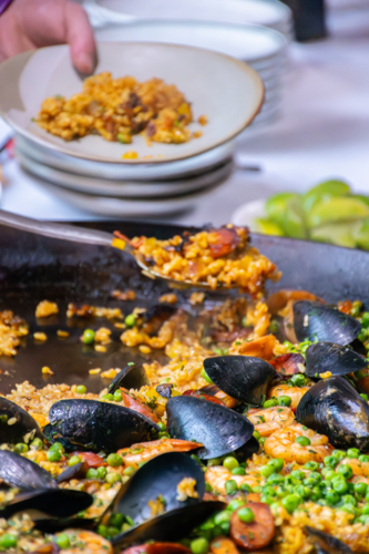 Close up of serving Paella - vertical - Australian Stock Image