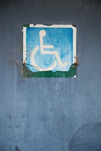 Close up of signs on public restroom toilet doors - disabled access - Australian Stock Image