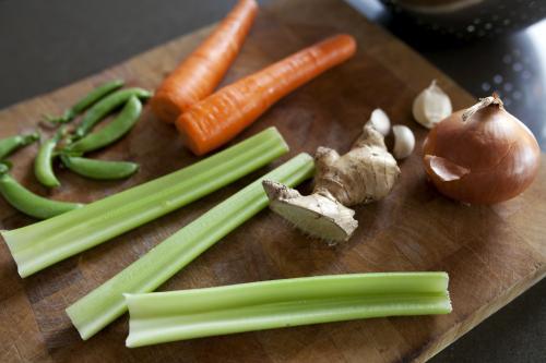 Close up of vegetables on chopping board - Australian Stock Image
