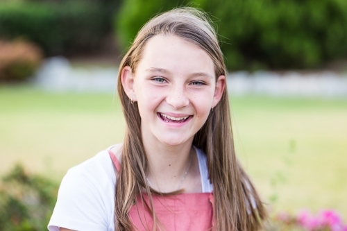 Close up of young girl smiling - Australian Stock Image