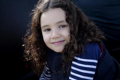 Close up of young happy brunette girl smiling - Australian Stock Image