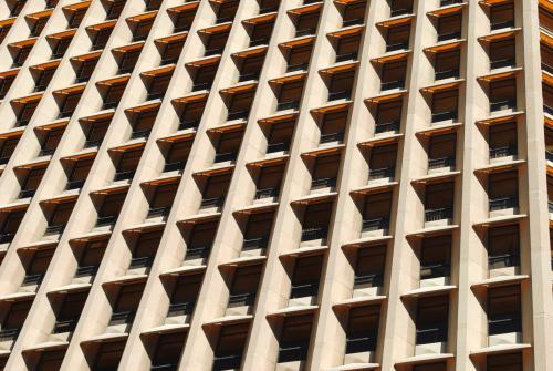 Close-up photo of the windows of a modern office building - Australian Stock Image