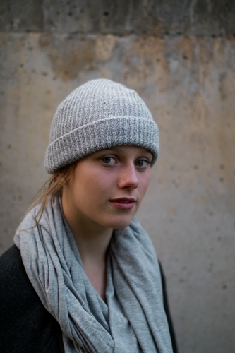 Close up portrait of young girl in a beanie - Australian Stock Image