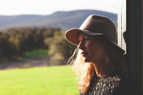 Close-up shot of a woman with countryside in the background - Australian Stock Image