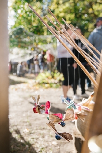 Close up shot of lollipops with ribbons tied to bamboo sticks - Australian Stock Image