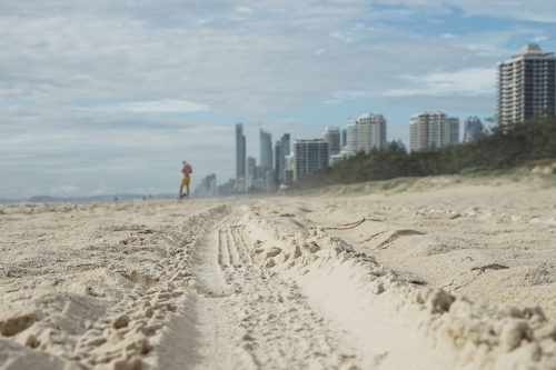 Close up tire tracks on beach - Australian Stock Image