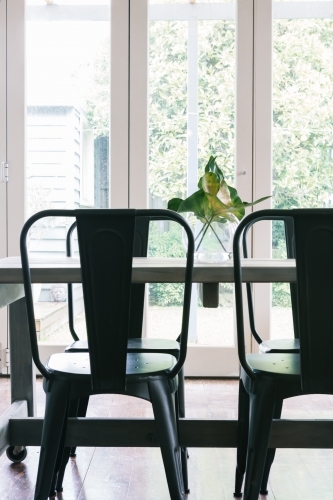 Close up vertical of black metal industrial styled dining table - Australian Stock Image