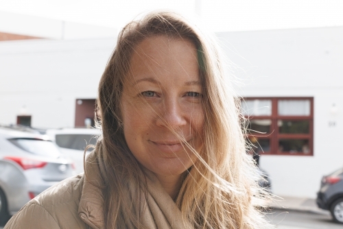Closeup of a woman with blonde hair on the street. - Australian Stock Image