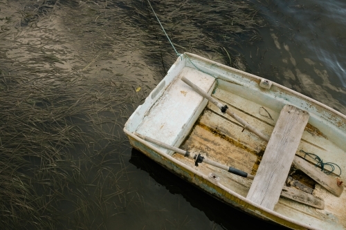 closeup shot of a parked white row boat - Australian Stock Image