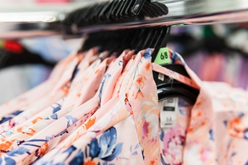 Clothing retails concept. Ladies pajamas on hangers in clothes store. - Australian Stock Image