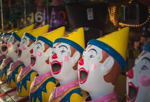 Clowns at a fair in an amusement park