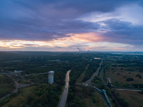 Coal mining and export infrastructure with coal fired power station on horizon - Australian Stock Image