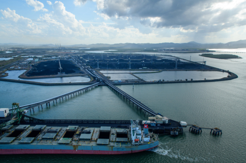 Coal ship docked at the coal terminal wharf - Australian Stock Image