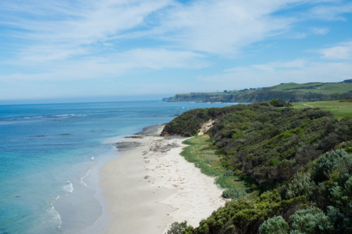 Coastal beach with blue water and sky - Australian Stock Image