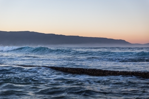 Coastal scene with waves at dusk - Australian Stock Image
