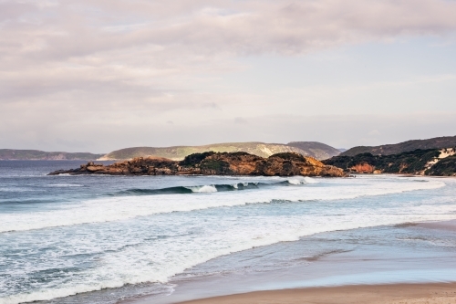 Coastal shot of beach with rocky headland - Australian Stock Image