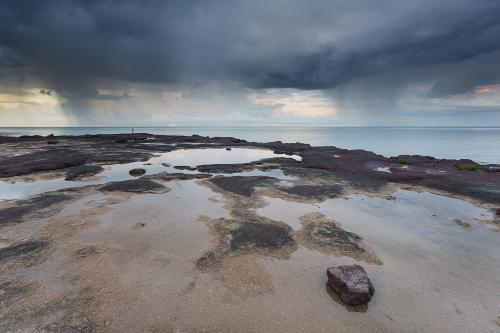 Coastal shower for fisherman at dusk - Australian Stock Image